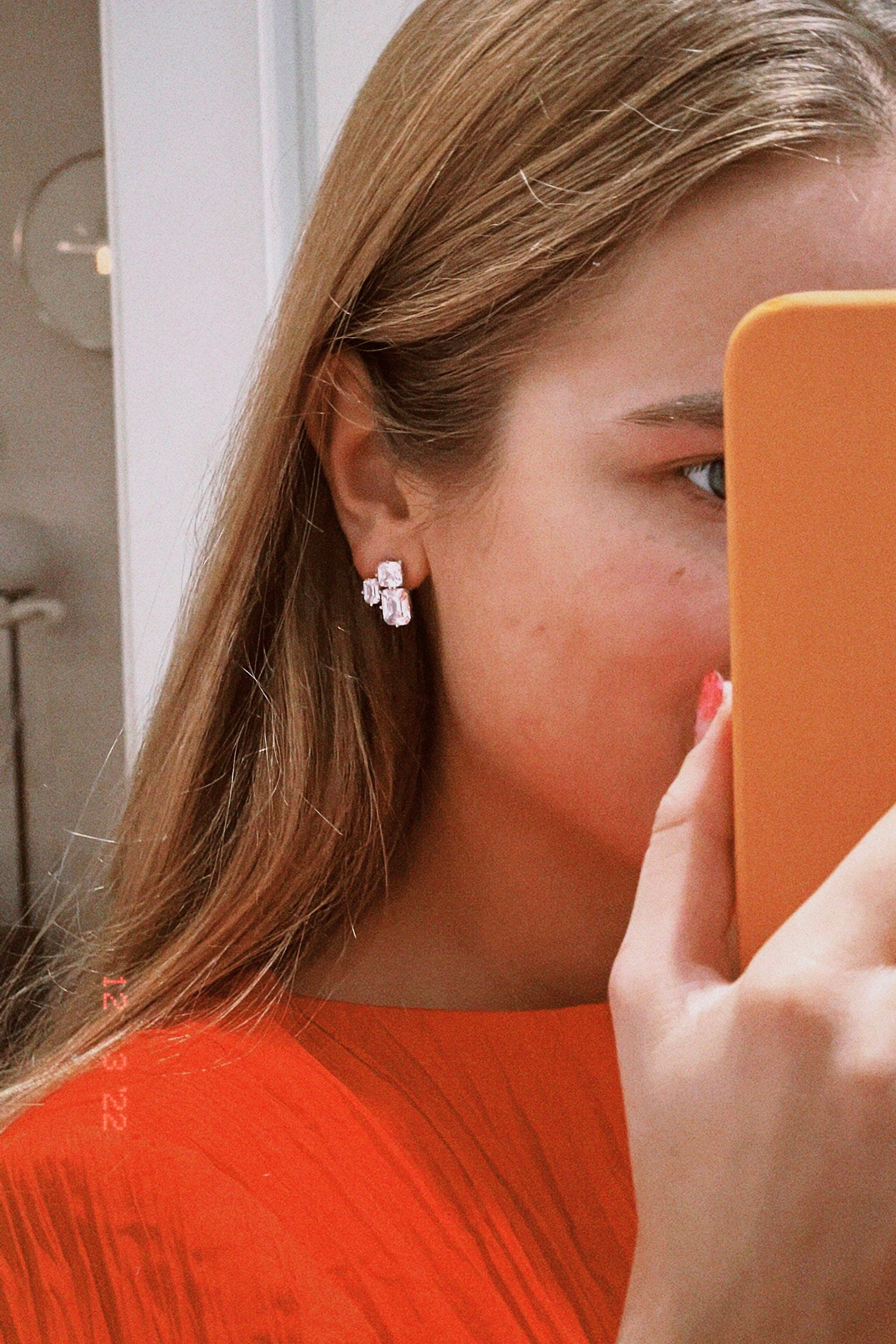 Triple Emerald Cut Studs: Rhodium-plated Sterling Silver Statement Earrings Adorned With High Carbon Diamonds.