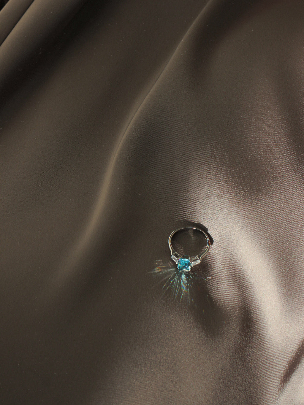 Light Blue Emerald Cut Ring. Rhodium-plated Streling Silver 925.