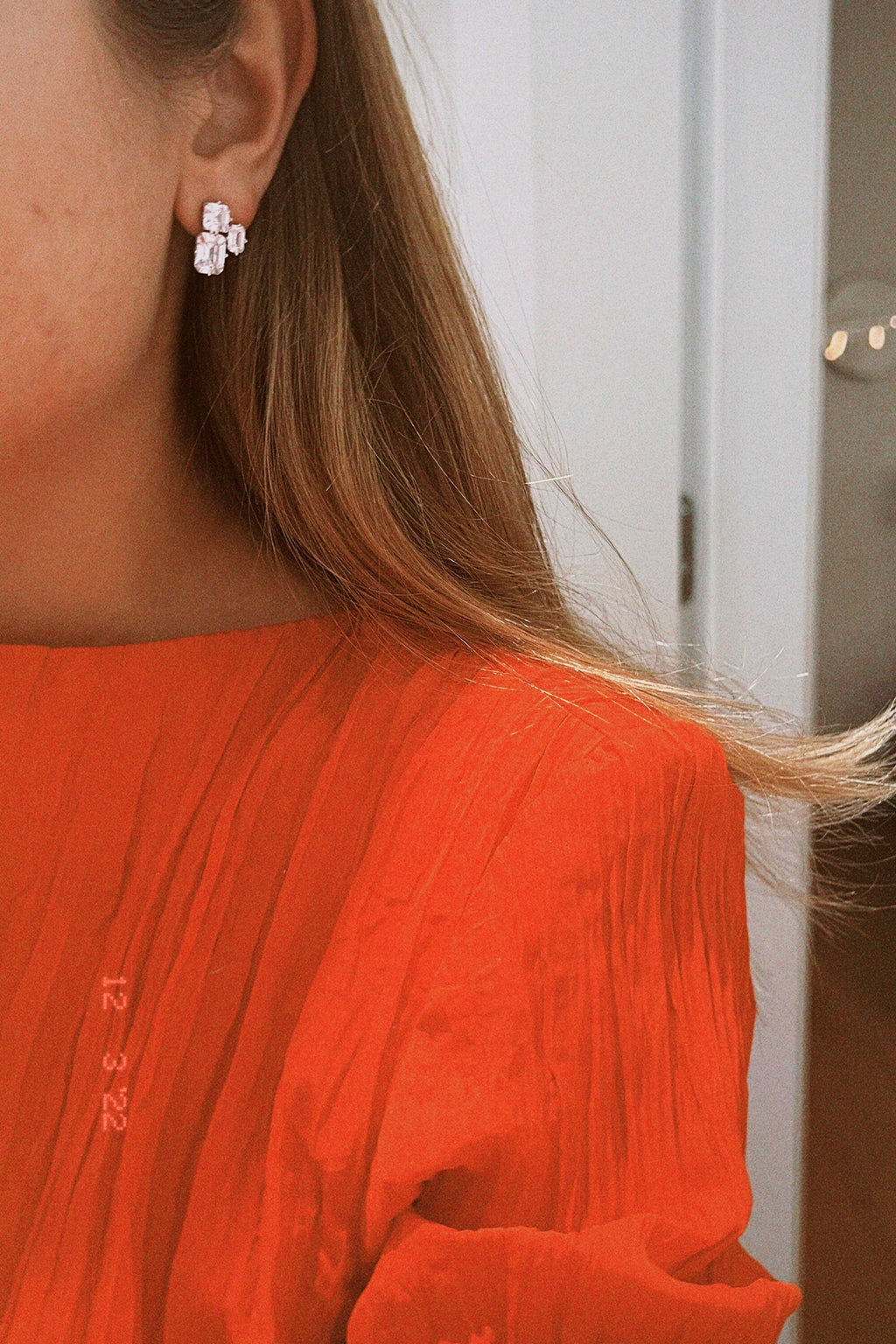 Triple Emerald Cut Studs: Rhodium-plated Sterling Silver Statement Earrings Adorned With High Carbon Diamonds.