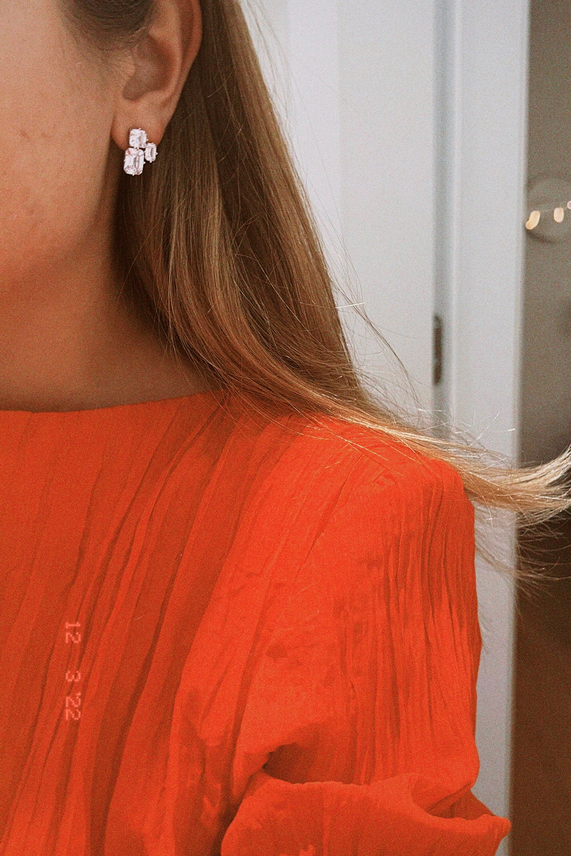 Triple Emerald Cut Studs: Rhodium-plated Sterling Silver Statement Earrings Adorned With High Carbon Diamonds.