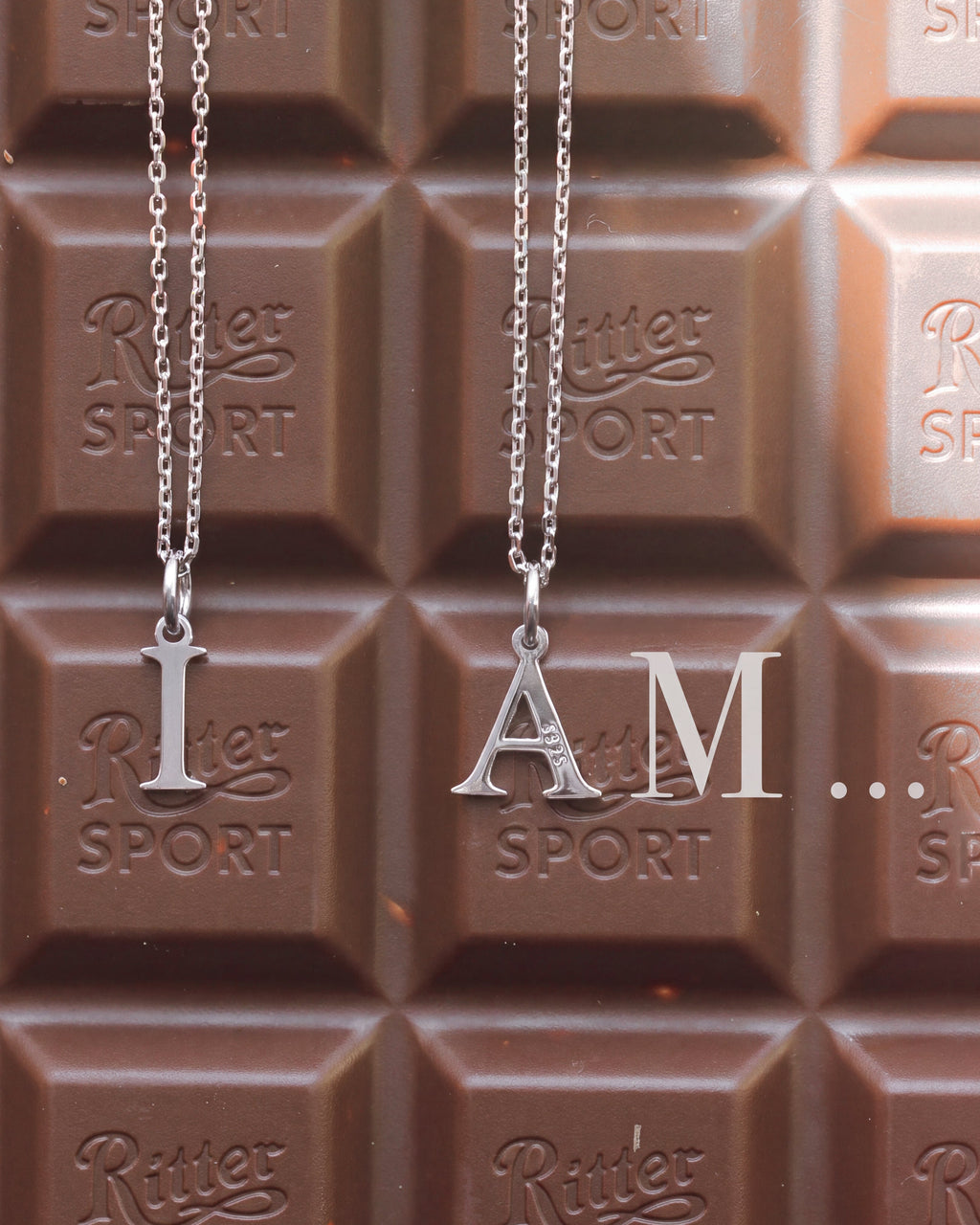 Tiny Silver Letter: Rhodium-Plated Sterling Silver 925