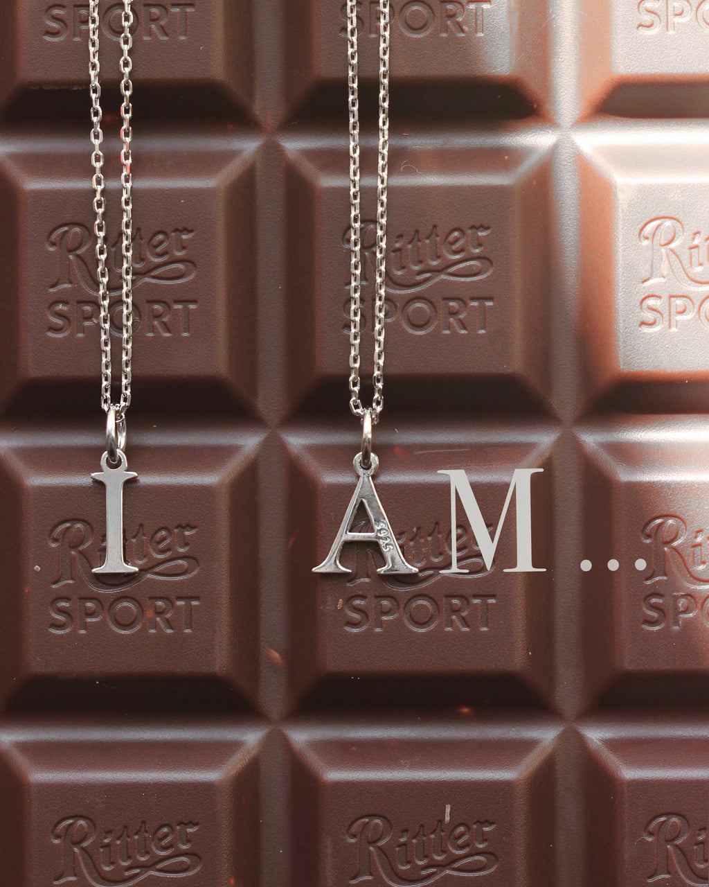 Tiny Silver Letter: Rhodium-Plated Sterling Silver 925