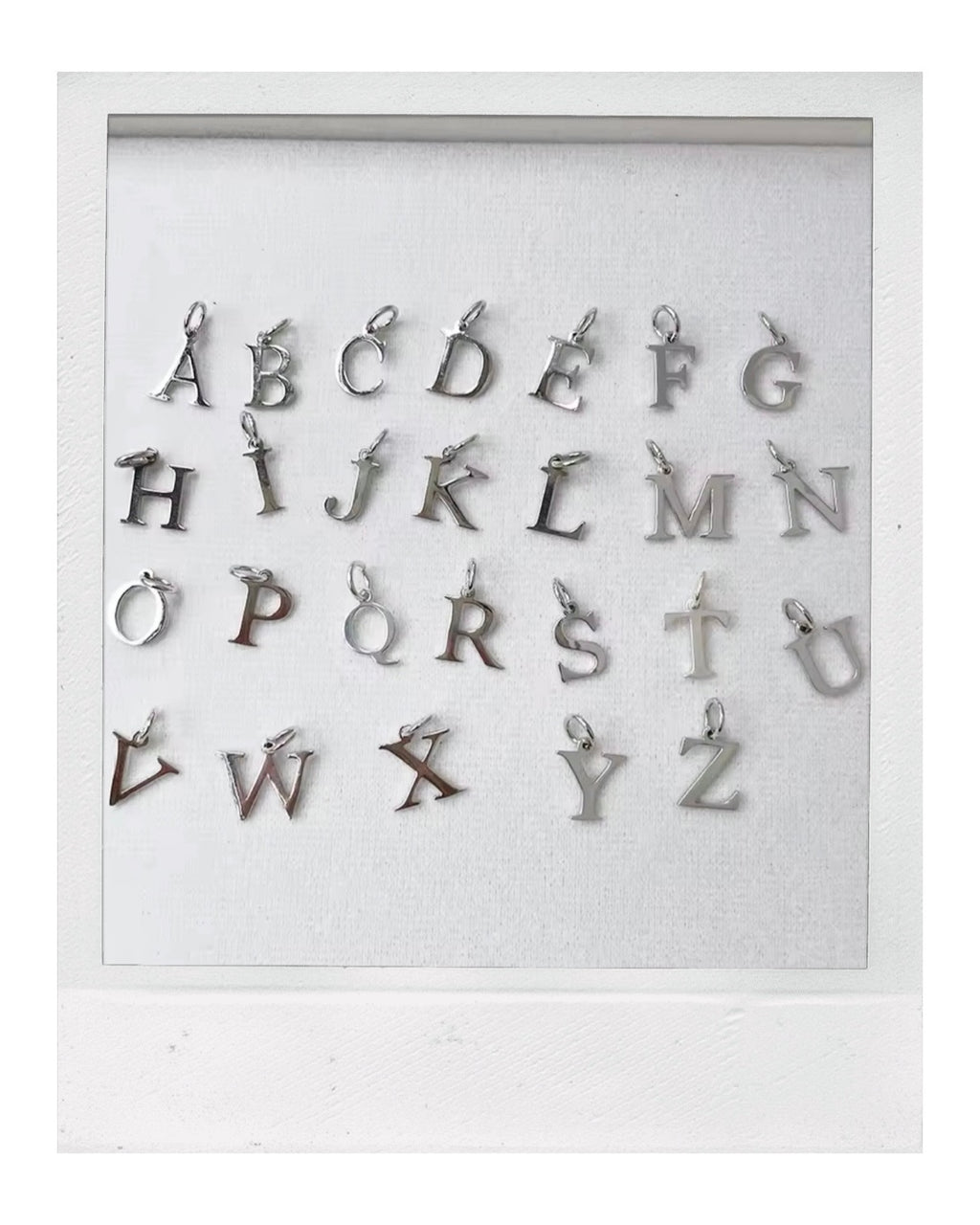 Tiny Silver Letter: Rhodium-Plated Sterling Silver 925