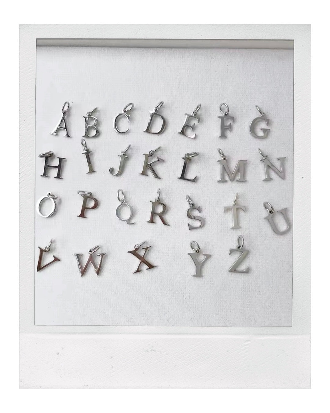 Tiny Silver Letter: Rhodium-Plated Sterling Silver 925